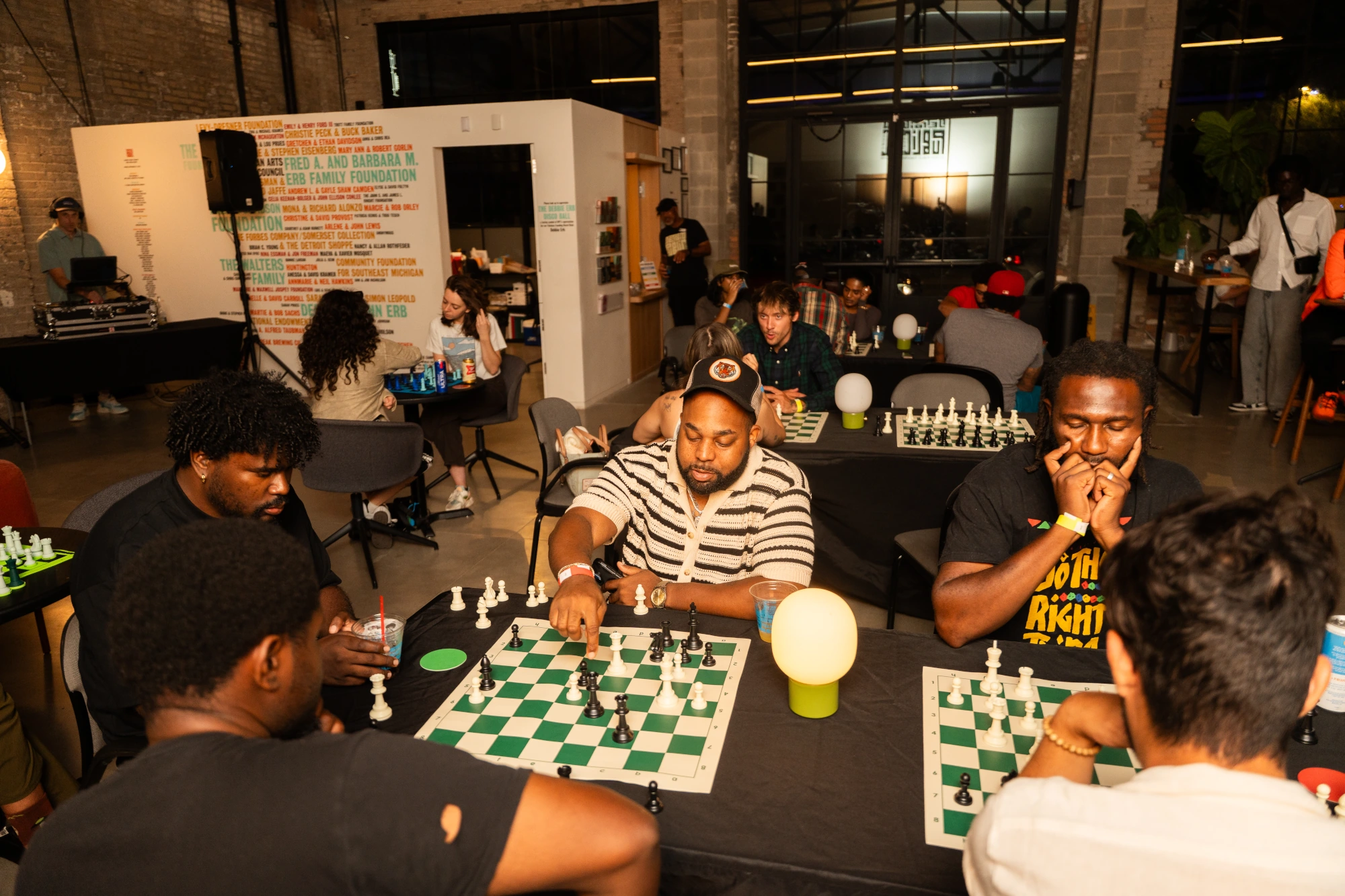 Deep thought on the tournament boards, DJ spinning in the back